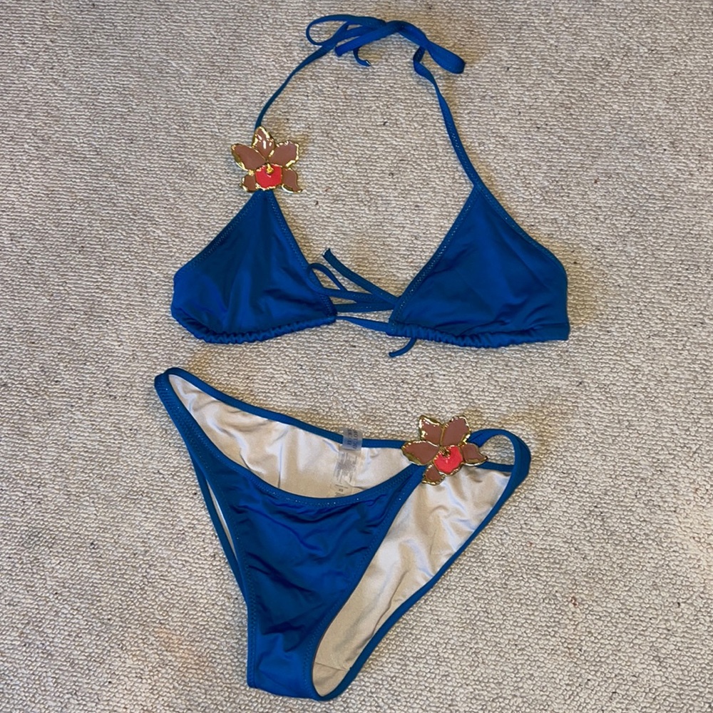 Victoria’s Secret string bikini with lacquered orchid details